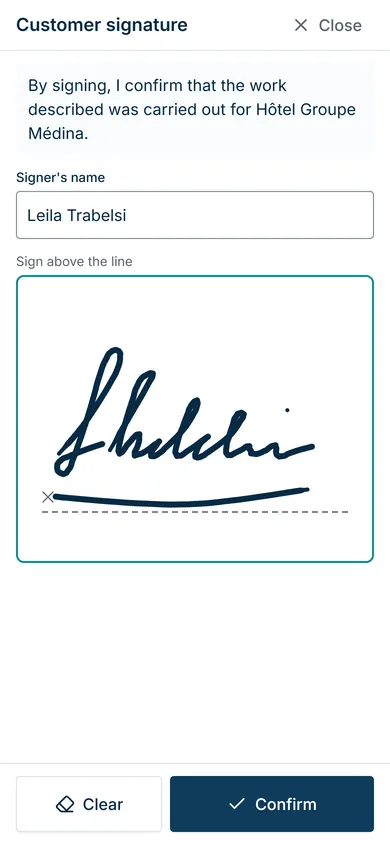 The customer signing on the phone screen at the end of the job.